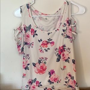 A flower shirt with cuts in the side